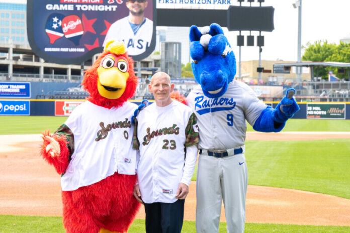 Retired Army Lt. Gen. Keith Huber, center, senior adviser for veterans and leadership initiatives at Middle Tennessee State University, is flanked by Nashville Sounds mascot Booster the Rooster, left, and MTSU’s mascot Lightning, right, at a Sounds game Wednesday, April 24, at First Horizon Park in Nashville, Tenn. Huber and Booster are displaying the Military Appreciation Jerseys that are being auctioned online through May 18 in support of MTSU’s Charlie and Hazel Daniels Veterans and Military Family Center. The Sounds will wear the jerseys May 13. (MTSU photo by James Cessna)