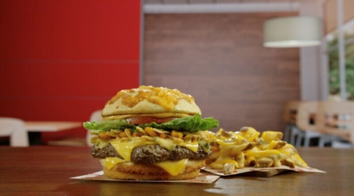 Score Big on Flavor with Wendy's Game-Changing Cheesy Duo: The Loaded Nacho Cheeseburger and Queso Fries.